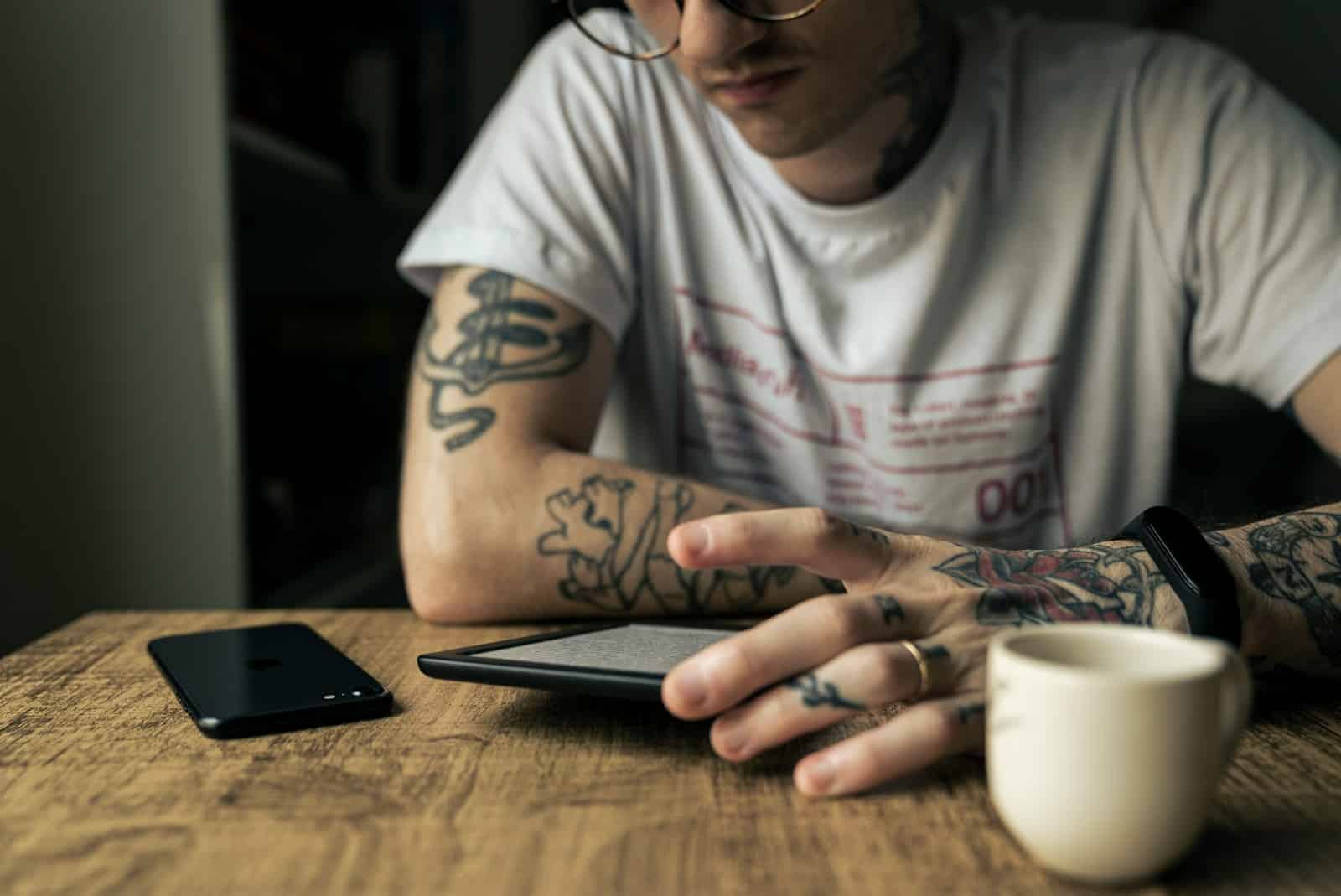 man in white crew neck t-shirt wearing black framed eyeglasses